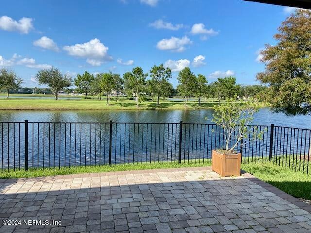 view of patio with a water view