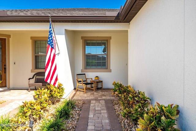 doorway to property with a patio area