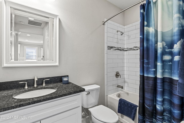 full bathroom featuring vanity, shower / bath combination with curtain, and toilet