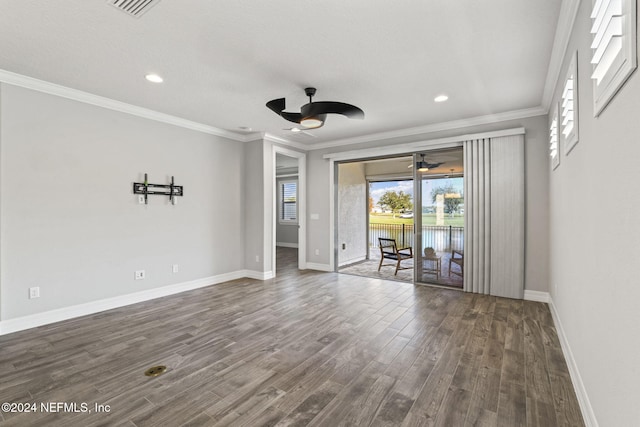 spare room featuring ceiling fan, dark hardwood / wood-style flooring, and ornamental molding