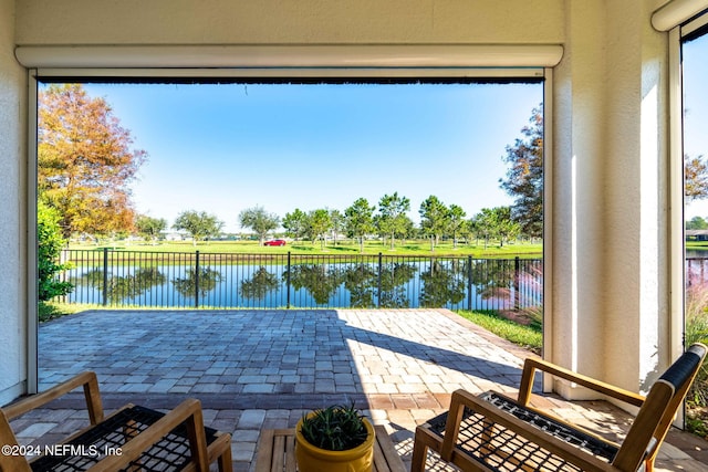 view of patio / terrace featuring a water view