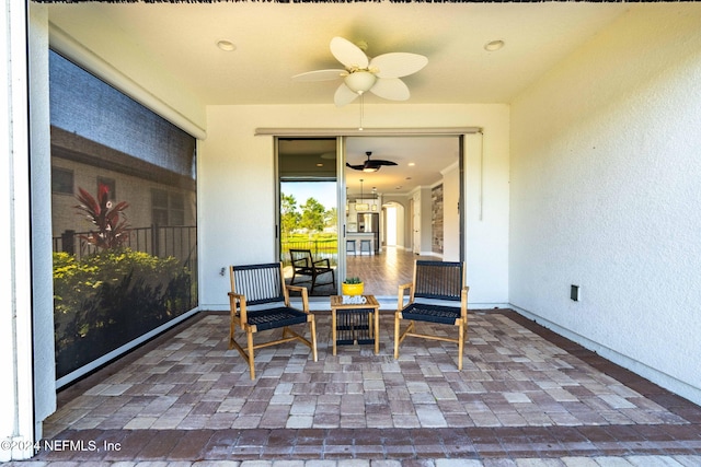 exterior space featuring ceiling fan