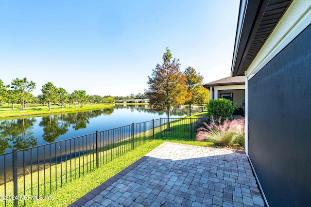 view of patio featuring a water view