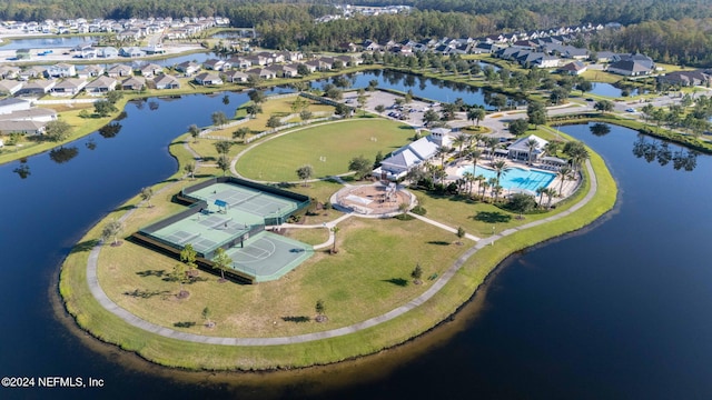 birds eye view of property with a water view and a residential view