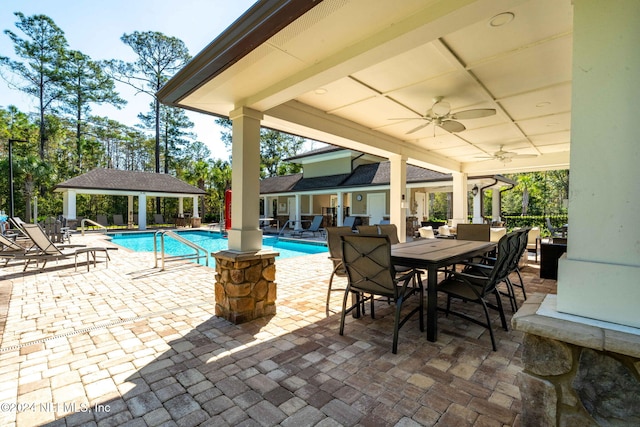 view of swimming pool with a gazebo, ceiling fan, and a patio