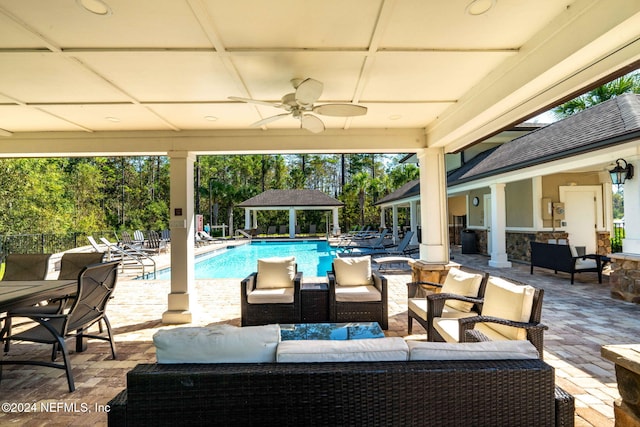 view of patio / terrace featuring a gazebo, outdoor lounge area, and ceiling fan