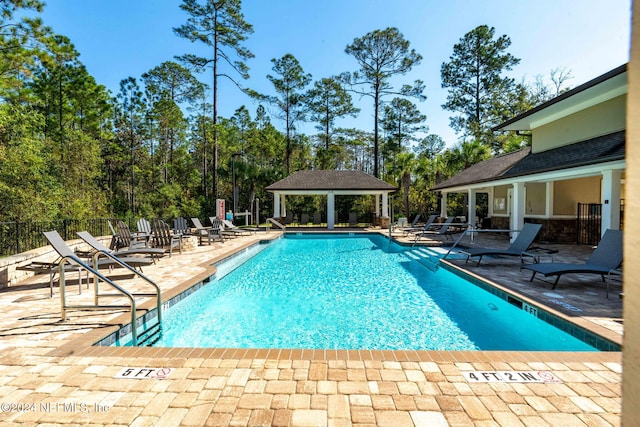 view of swimming pool featuring a gazebo and a patio area