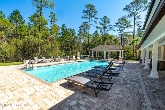 view of swimming pool featuring a gazebo and a patio area