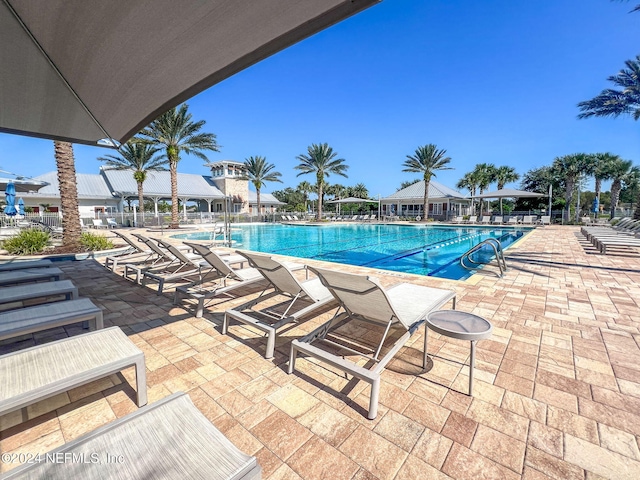 view of swimming pool featuring a patio area