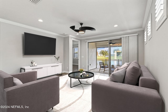 carpeted living room with ceiling fan and crown molding