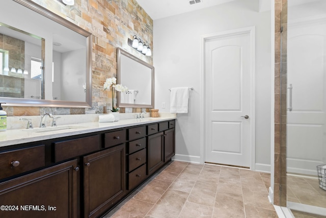 bathroom featuring tile patterned flooring and vanity