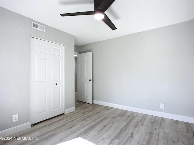 unfurnished bedroom featuring a closet, ceiling fan, and light hardwood / wood-style floors