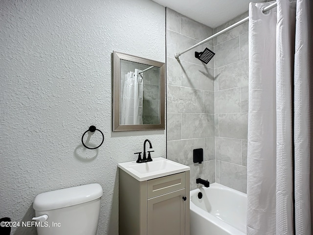 full bathroom featuring vanity, shower / bath combo, and toilet