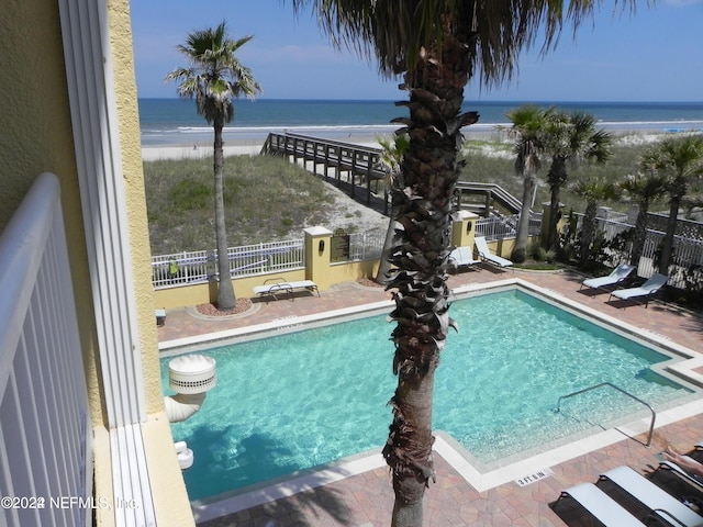 1031 1st St S Unit 504, Jacksonville Beach, FL 32250 - pool featuring a water view, fence, and a patio area