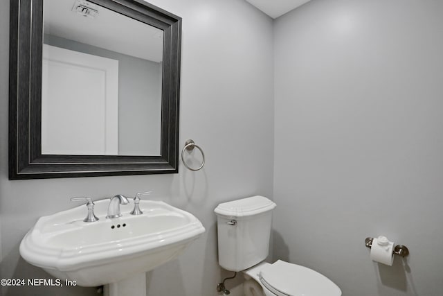 bathroom with sink and toilet