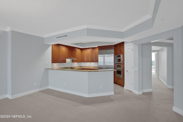 1031 1st St S Unit 504, Jacksonville Beach, FL 32250 - kitchen with ornamental molding, a sink, visible vents, a peninsula, and appliances with stainless steel finishes