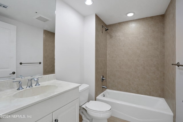 full bathroom with vanity, toilet, and tiled shower / bath