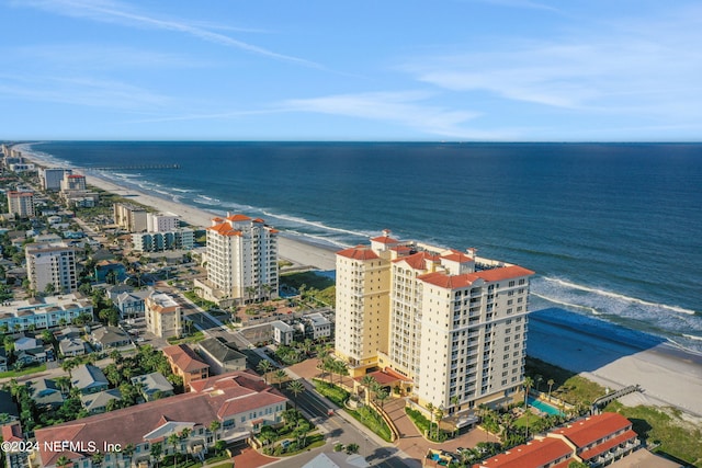 drone / aerial view with a view of the beach and a water view