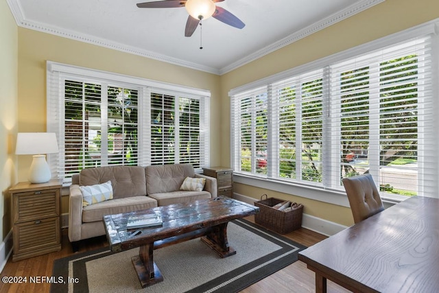 living room with ceiling fan, wood-type flooring, and ornamental molding