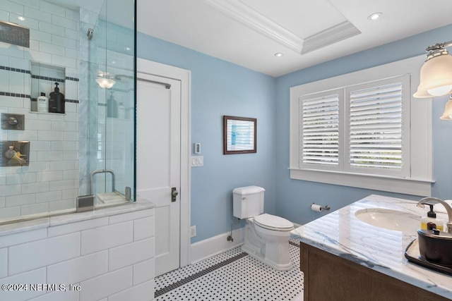 bathroom with vanity, a shower with door, a raised ceiling, crown molding, and toilet