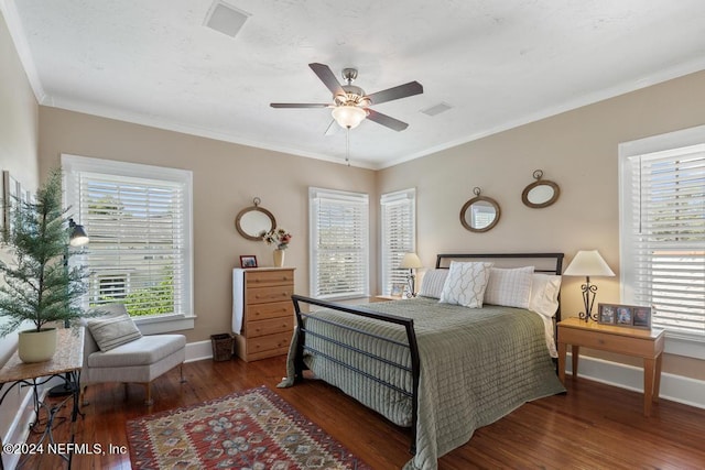 bedroom featuring ornamental molding, ceiling fan, and dark wood-type flooring