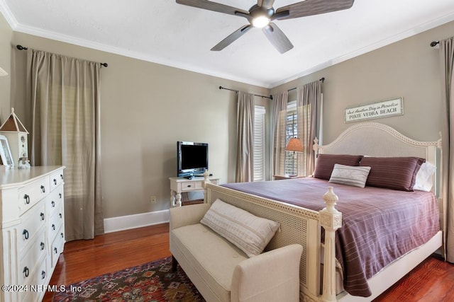 bedroom with dark hardwood / wood-style floors, ceiling fan, and ornamental molding