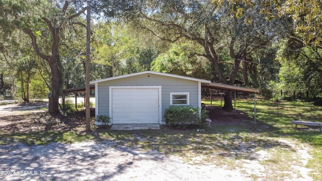 garage featuring a carport