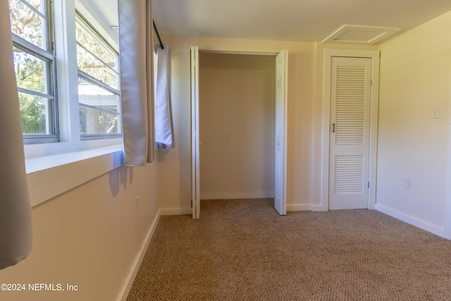 unfurnished bedroom with carpet floors