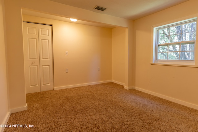 spare room featuring carpet floors