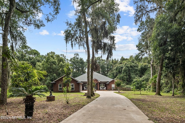 ranch-style house with a front lawn