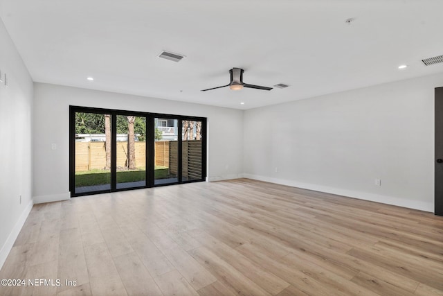 unfurnished room with ceiling fan and light hardwood / wood-style flooring