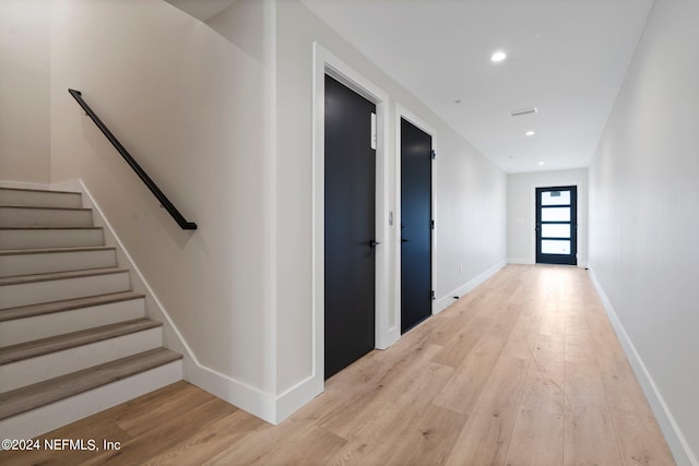 121 12th Ave S, Jacksonville Beach, FL 32250 - hall featuring light wood-style flooring, stairway, recessed lighting, and baseboards