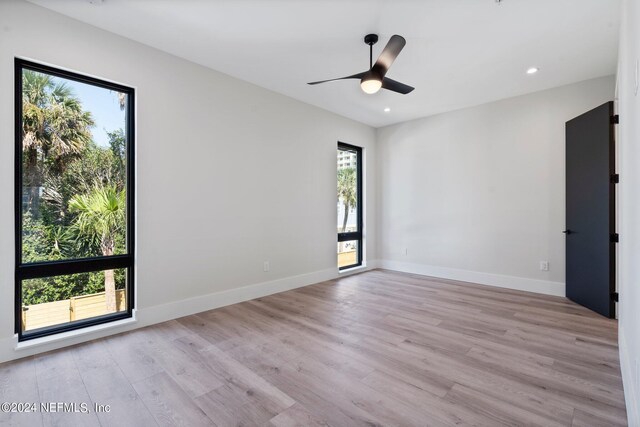 121 12th Ave S, Jacksonville Beach, FL 32250 - empty room with healthy amount of natural light, light wood-type flooring, baseboards, and recessed lighting