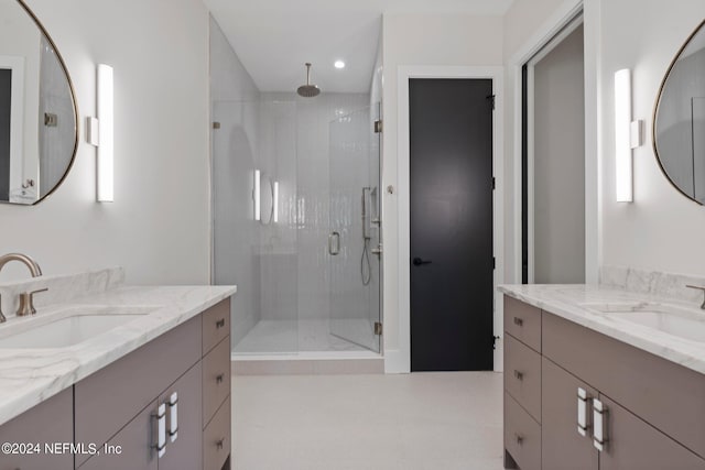 121 12th Ave S, Jacksonville Beach, FL 32250 - bathroom featuring a shower stall, two vanities, and recessed lighting