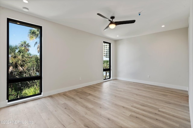 unfurnished room featuring ceiling fan and light hardwood / wood-style flooring