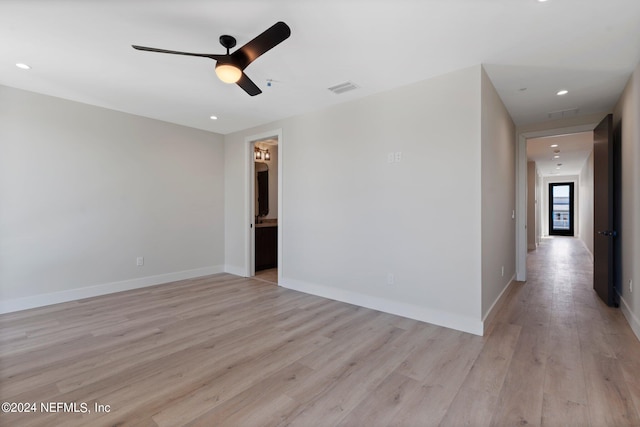 unfurnished room featuring ceiling fan and light hardwood / wood-style flooring