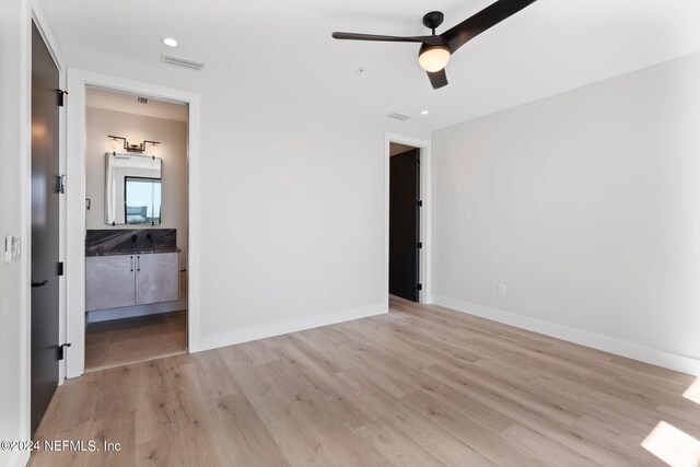 unfurnished bedroom featuring light hardwood / wood-style floors and ceiling fan