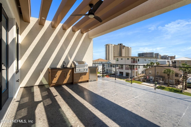 balcony with ceiling fan, an outdoor kitchen, and area for grilling