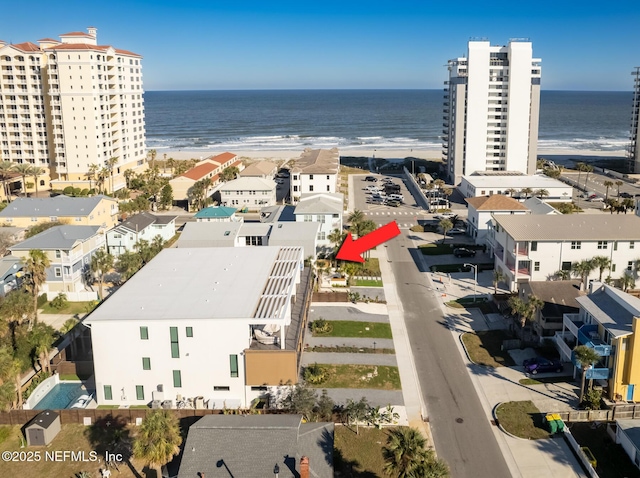 drone / aerial view with a view of the beach and a water view