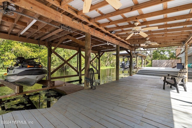 dock area featuring boat lift and fence