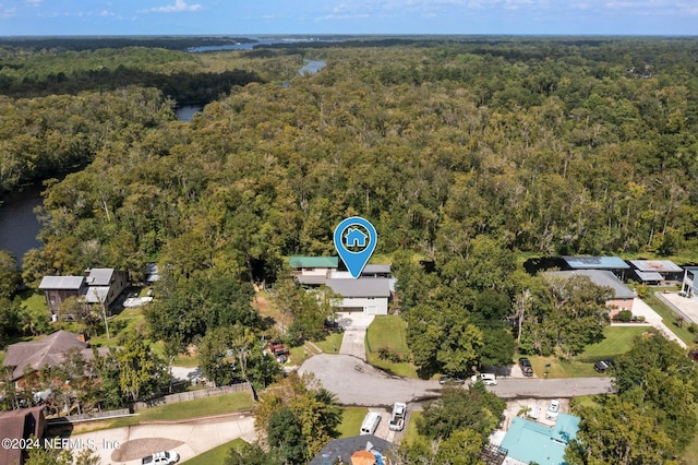 drone / aerial view featuring a view of trees
