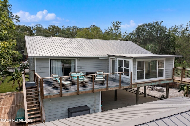 deck with a patio and stairs