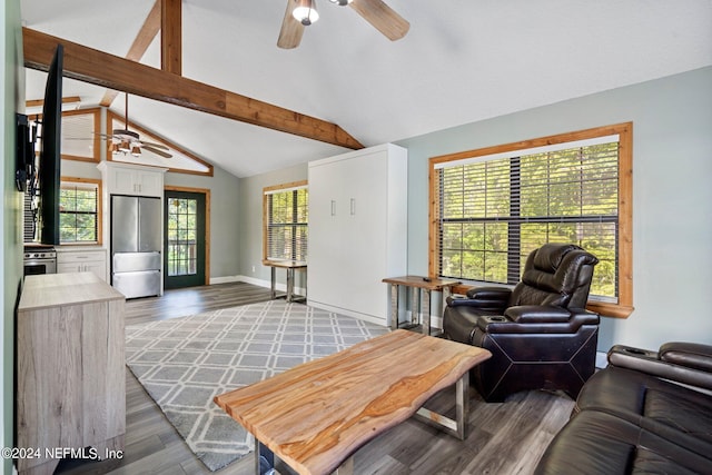living room with baseboards, ceiling fan, wood finished floors, and vaulted ceiling with beams