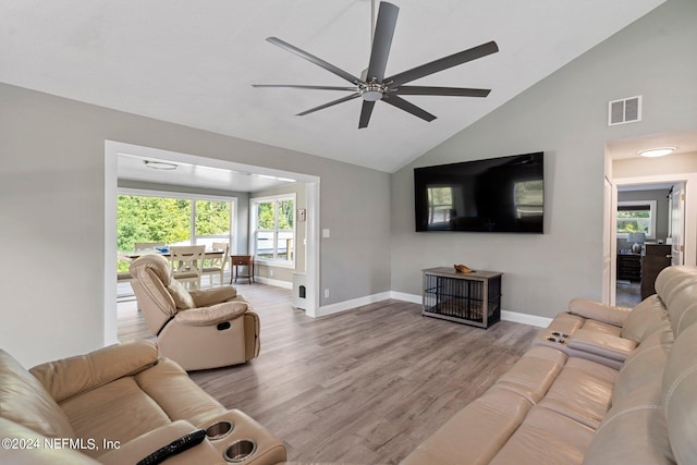 living area featuring high vaulted ceiling, baseboards, visible vents, ceiling fan, and wood finished floors