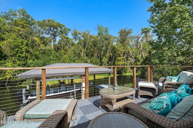 wooden terrace featuring an outdoor living space