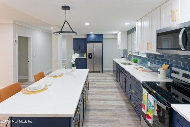 kitchen with light wood-type flooring, blue cabinets, and stainless steel appliances