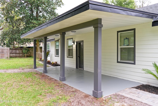 view of patio featuring fence