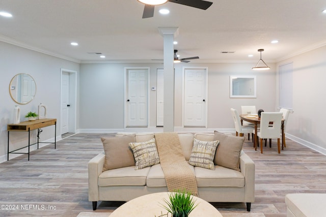 living room with recessed lighting, crown molding, light wood-style floors, and a ceiling fan