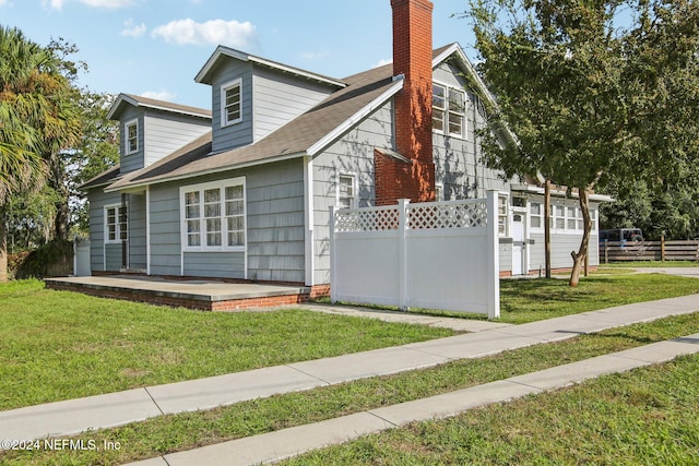 view of side of property with a yard