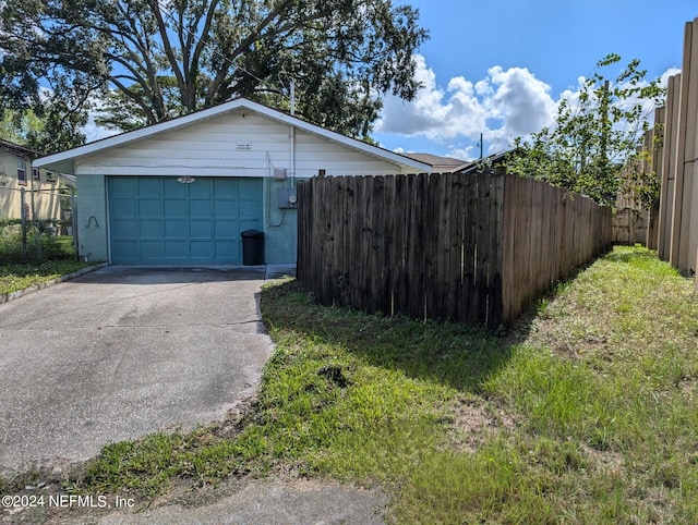 view of front facade with an outbuilding and a garage